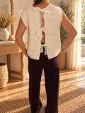 Pull sans manches écru réversible avec nœuds en dentelle